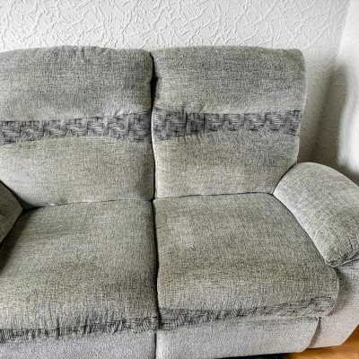 Before deep cleaning a heavily soiled modular sectional sofa, highlighting the visible difference professional treatment will achieve.