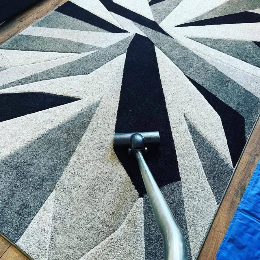 Deep cleaning of patterned carpet using hot water extraction.