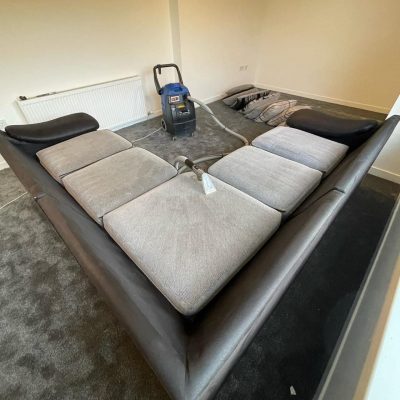 Cleaning equipment detail, showing the powerful extraction hose and water source used for efficient and thorough on-site cleaning jobs.