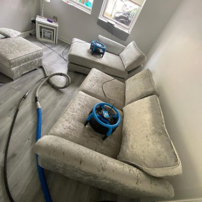 Dirty water extracted from carpets/upholstery, proving the effectiveness of the deep cleaning process and the amount of dirt removed.